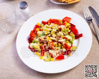 Fresh salad with avocado tomato bell pepper and corn