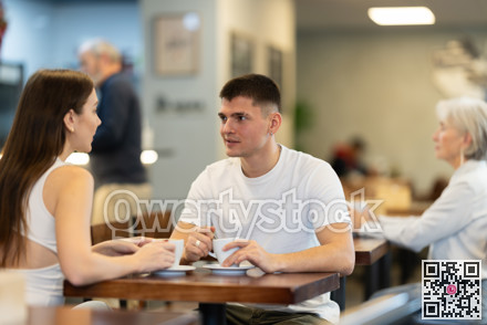 Girl in cafe sits near guy companion, has nice conversation
