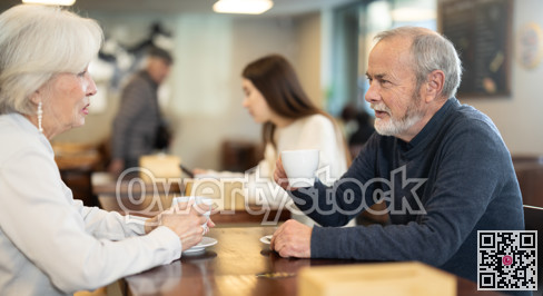 Mature couple spend time in cafe