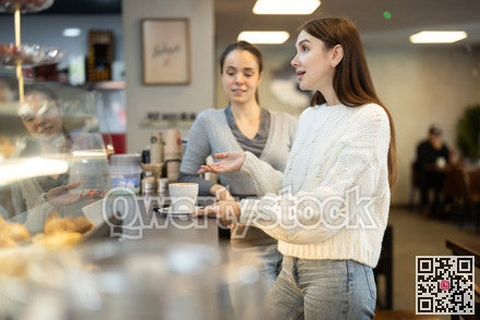 Two female friends met in a cafe