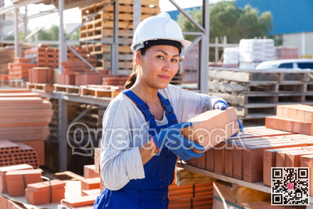 Asian woman worker is laying bricks