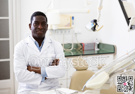 Positive african american dentist doctor in clinic