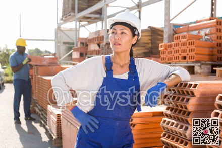 Asian woman worker posing at hardware store