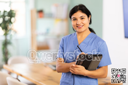 Doctor woman with tablet stands in office space