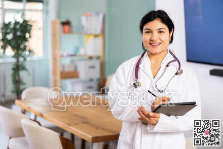 Doctor woman with tablet stands in office space