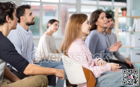 Young people are listening to lecture in auditorium