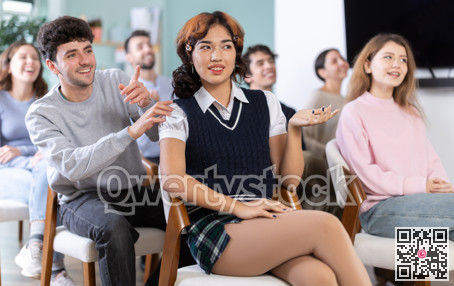 Classmates listening and talking during group discussion in class
