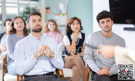 Students sit attentively in the classroom and listen to lectures