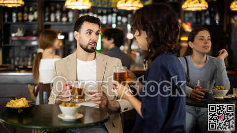 Couple in love is spending time at bar