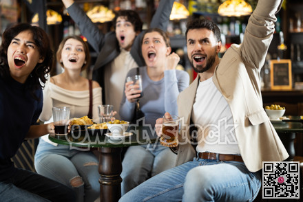 Fans watching match at a sports bar, cheering with drinks, energetic atmosphere, friendship and fun, people enjoying game together indoors