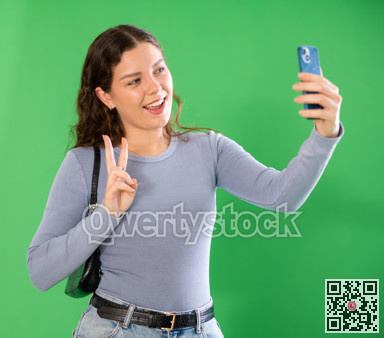 Girl takes selfie, captures herself in significant moment