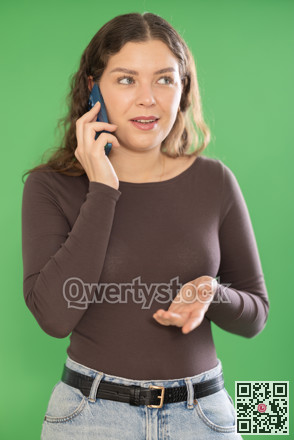Happy girl is talking to someone on mobile phone. Chroma key compositing.