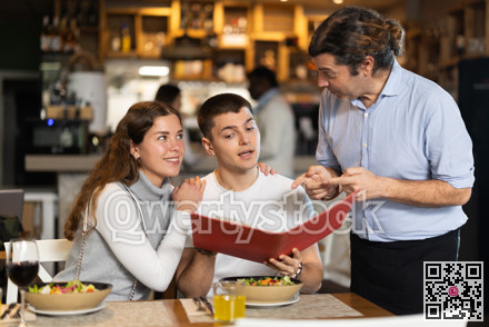 Man listen to restaurant couple customer, writes down order