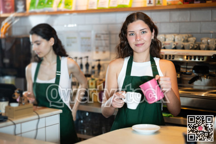 Girl cafe worker pours coffee from cezve coffee pot into cup