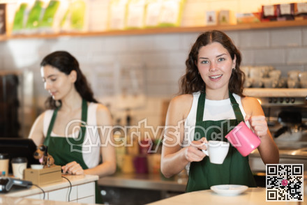 Young woman pouring coffee in cafe