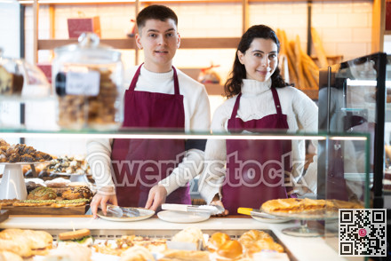 Young woman and man at cafe window