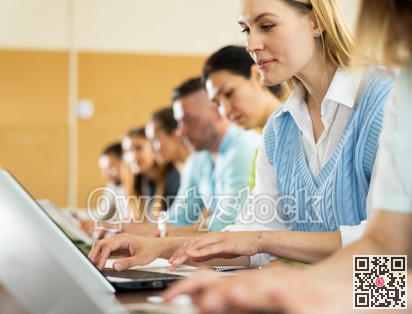 Group of students attentively listening to lecture in university classroom