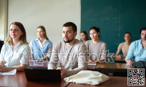 University students exercising in class room