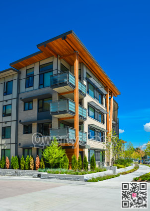 Brand new apartment building on sunny day in British Columbia, Canada.