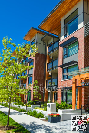 Brand new apartment building on sunny day in British Columbia, Canada.