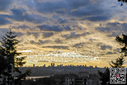 Big city landscape at sunset on cloudy sky background in Vancouver, Canada