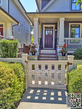 Porch and entrance of a nice residential house with two flower pots