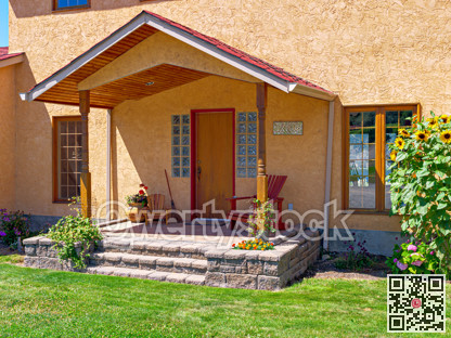 Entrance of a nice residential house with green lawn in front