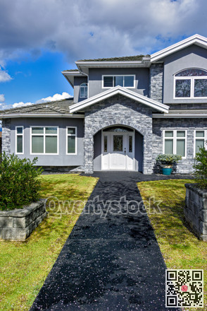 Nice residential house with stone texture walls and stone walls on front yard