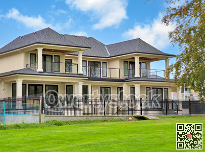 A perfect neighbourhood. New luxury residential house on cloudy sky background