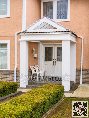 Entrance of residential house under transparent porch