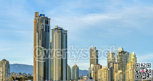 Settled and new high rise residential buildings on blue sky background