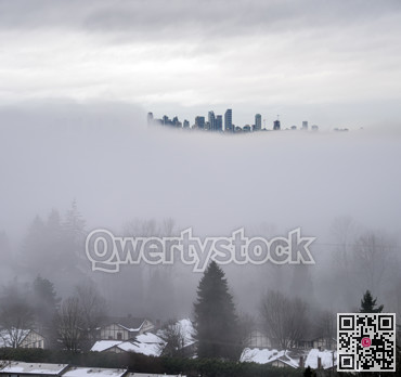 City in the sky. Foggy winter morning in Vancouver, Canada