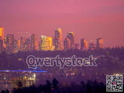 Unusual night city silouette highlighted with sunset rays in Surrey, BC