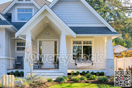 Residential house with open patio under the porch on sunny autumn day