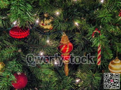 Halo of electtric lights and color balls decorating artificial Christmas tree