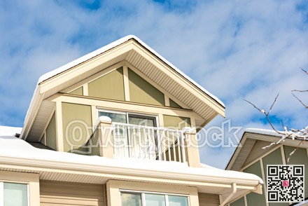Top of residential house on blue sky background on winter season in Canada