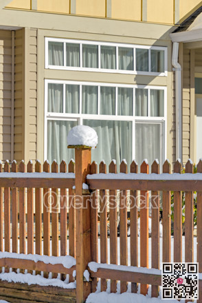 Bright sunny winter day on front yard of residential house in Canada