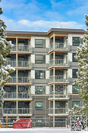 New low-rise residential building on finale stage of construction in winter