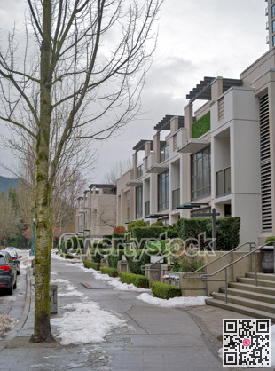 Row of residential townhouses on overcast winter day in Coquitlam, BC