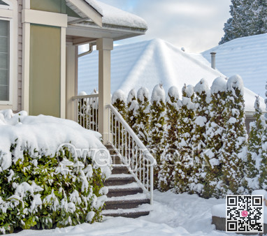 Porch and doorsteps of residential house in snow