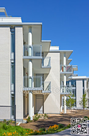 New residential buildings on final stage of construction with blue sky background