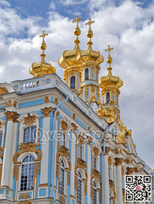 Golden domes against the background of clouds and blue sky