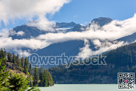 Mountain landscape with cloudy blue sky background