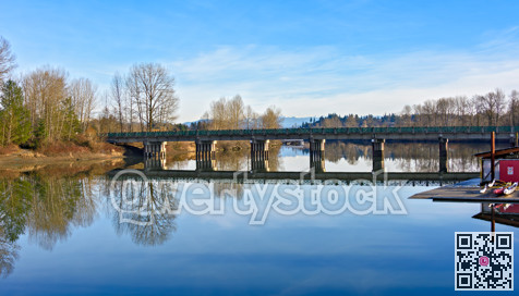 A beautiful river landscape with a white church on the shore